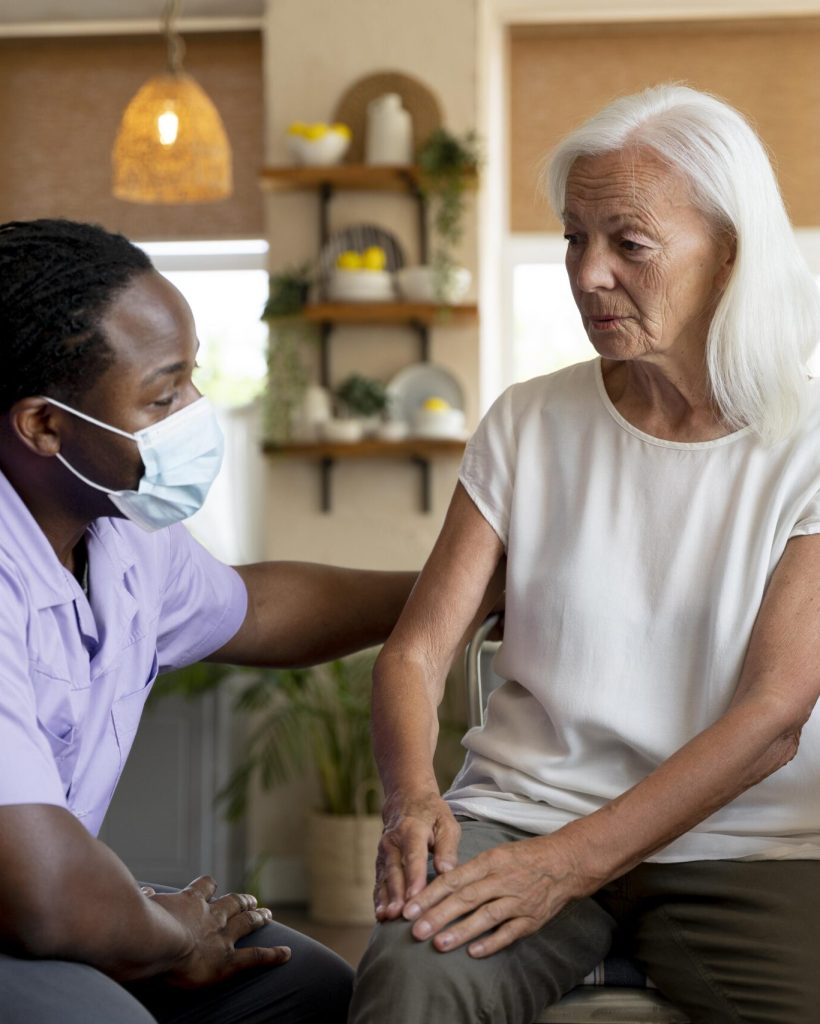 male-social-worker-taking-care-old-woman